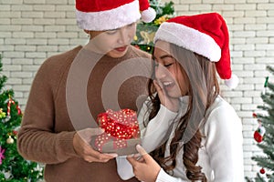 Man giving girl christmas present