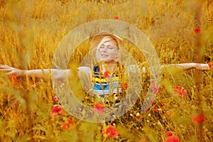 Beautiful happy blond woman enjoying the life. Freedom, nature, summer holiday and field of wheat concept