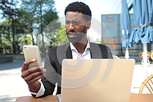 Beautiful happy business man outside in the park