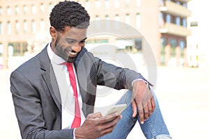 Beautiful happy business man outside in the park