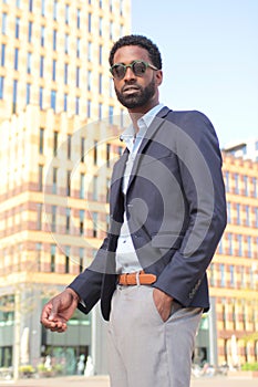 Beautiful happy business man outside in the park