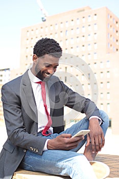 Beautiful happy business man outside in the park