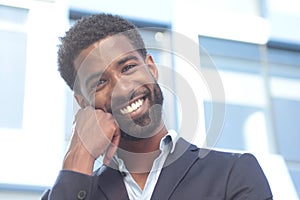 Beautiful happy business man outside in the park