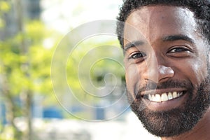 Beautiful happy business man outside in the park