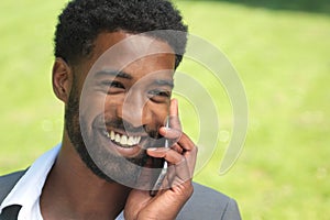 Beautiful happy business man outside in the park