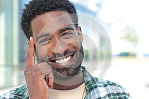 Beautiful happy business man outside in the park