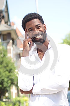 Beautiful happy business man outside in the park