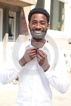 Beautiful happy business man outside in the park