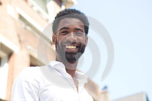 Beautiful happy business man outside in the park