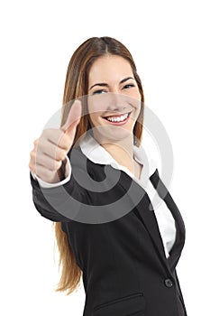 Beautiful happy business woman gesturing thumb up photo