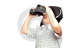 Child in pirate hat looking in binoculars