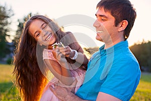 Beautiful happy family outdoors during sunset father dad daugh