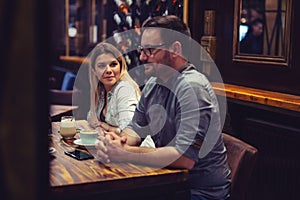 Beautiful happy friends enjoying their afternoon coffee