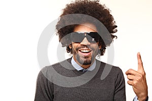 Beautiful happy funky afro man posing in front of a background