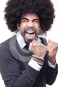 Beautiful happy funky afro man posing in front of a background