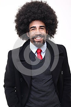 Beautiful happy funky afro man posing in front of a background