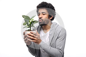 Beautiful happy funky afro man posing in front of a background