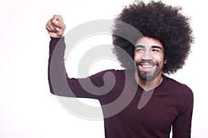 Beautiful happy funky afro man posing in front of a background