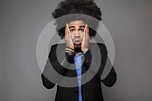 Beautiful happy funky afro man posing in front of a background