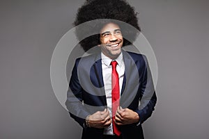 Beautiful happy funky afro man posing in front of a background