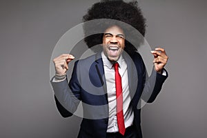Beautiful happy funky afro man posing in front of a background