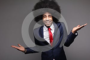 Beautiful happy funky afro man posing in front of a background