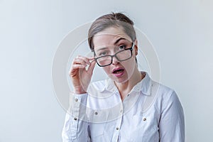 Beautiful happy girl smiling. Beauty simple portrait young smiling brunette woman in eyeglasses isolated on white background.