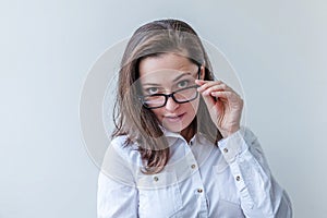 Beautiful happy girl smiling. Beauty simple portrait young smiling brunette woman in eyeglasses isolated on white background.