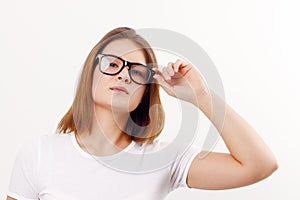 Beautiful happy girl teenager in glasses poses