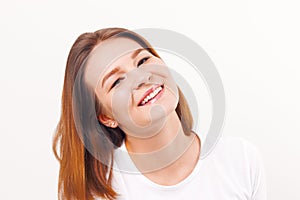 Beautiful happy girl teenager in t-shirt smiles