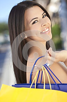 Beautiful Happy Hispanic Woman With Shopping Bags