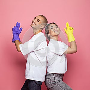 Beautiful happy laughing couple, young man and woman. Cleaning concept