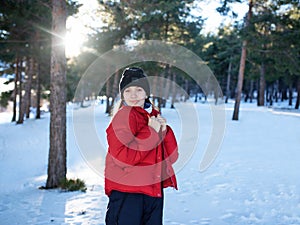 Beautiful happy laughing young girl dressed in winter clothes