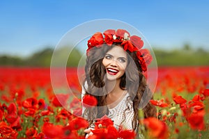 Beautiful happy smiling teen girl portrait with red flowers on h