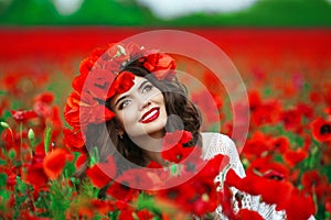 Beautiful happy smiling teen girl portrait with red flowers on h