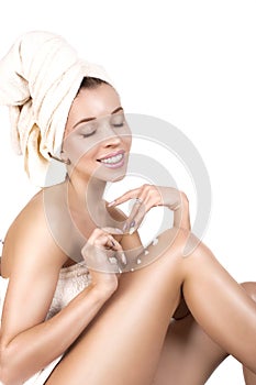 Beautiful Happy Spa Girl Isolated on a White Background. Touching her Face. Happy Woman after Bath with Clean Perfect