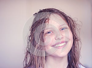 Beautiful happy teen girl with wet hair