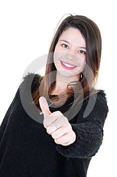 Beautiful happy teenager girl with thumb up