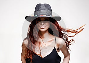 Beautiful happy woman in Hat, with curly long red hair