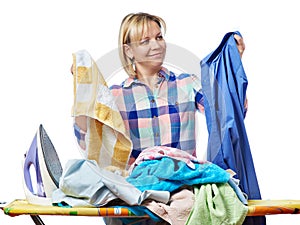 Beautiful happy woman housewife holding laundry for ironing