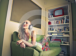 Beautiful happy woman listening to the music
