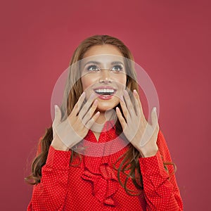 Beautiful happy woman looking up on colorful bright pink background. Perfect girl laughing portrait. Positive emotion