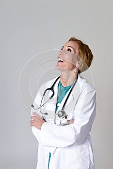 Beautiful and happy woman md doctor or nurse posing smiling cheerful with stethoscope