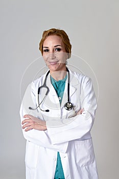 Beautiful and happy woman md doctor or nurse posing smiling cheerful with stethoscope