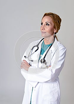 Beautiful and happy woman md doctor or nurse posing smiling cheerful with stethoscope