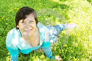 Beautiful happy woman resting in the park, relaxing and having f