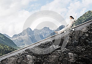 Beautiful happy woman riding downhill