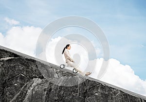 Beautiful happy woman riding downhill