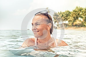 Beautiful happy woman sea tropical beach portrait summer vacation holidays lifestyle