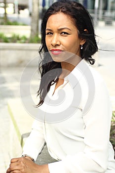 Beautiful happy young black woman outside in the park
